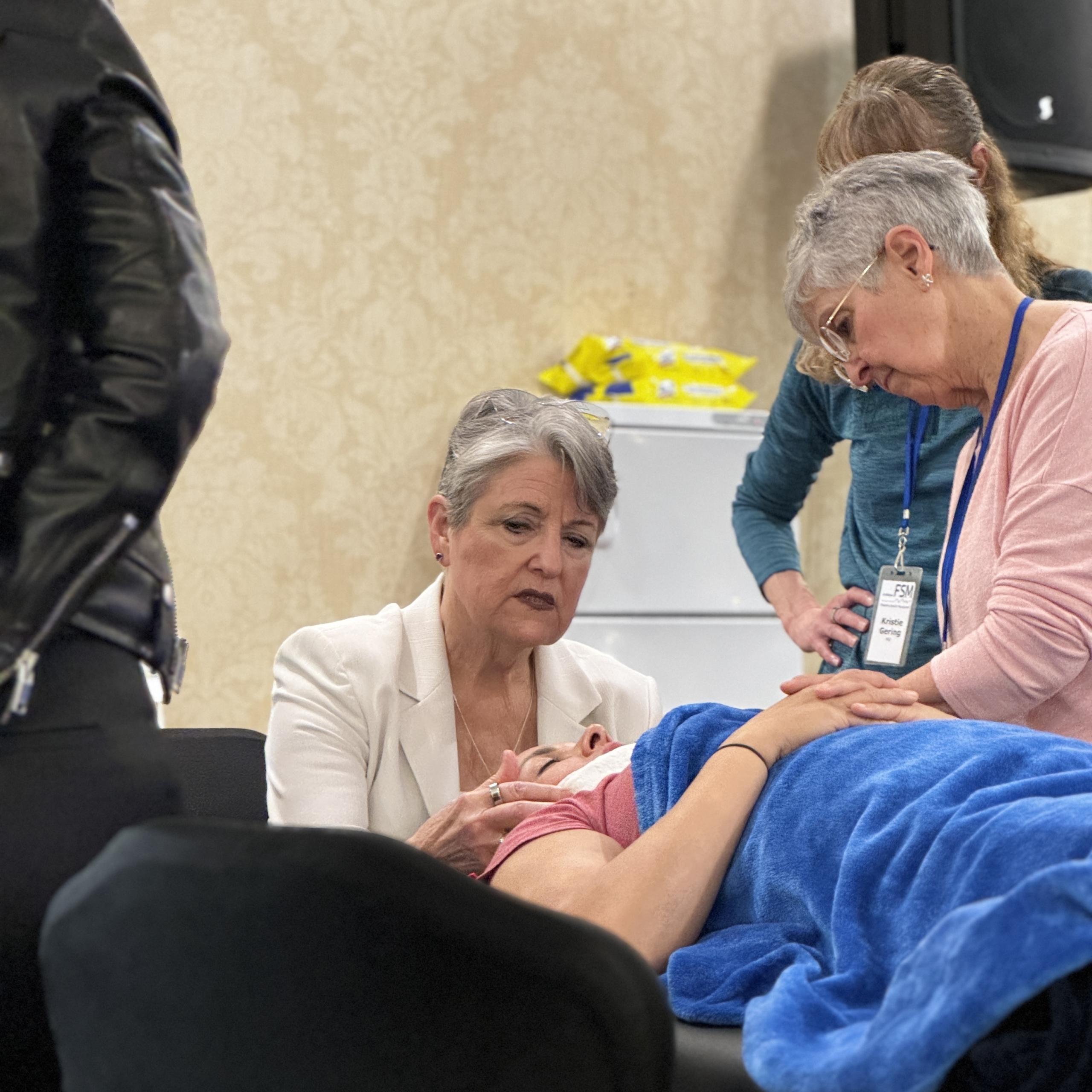 Dr. Carolyn McMakin mentoring a practitioner during hands-on cervical treatment